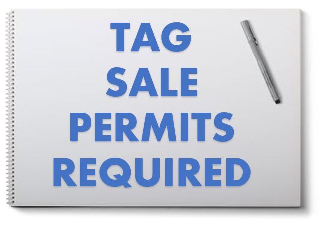 A white notebook is splayed open with the words 