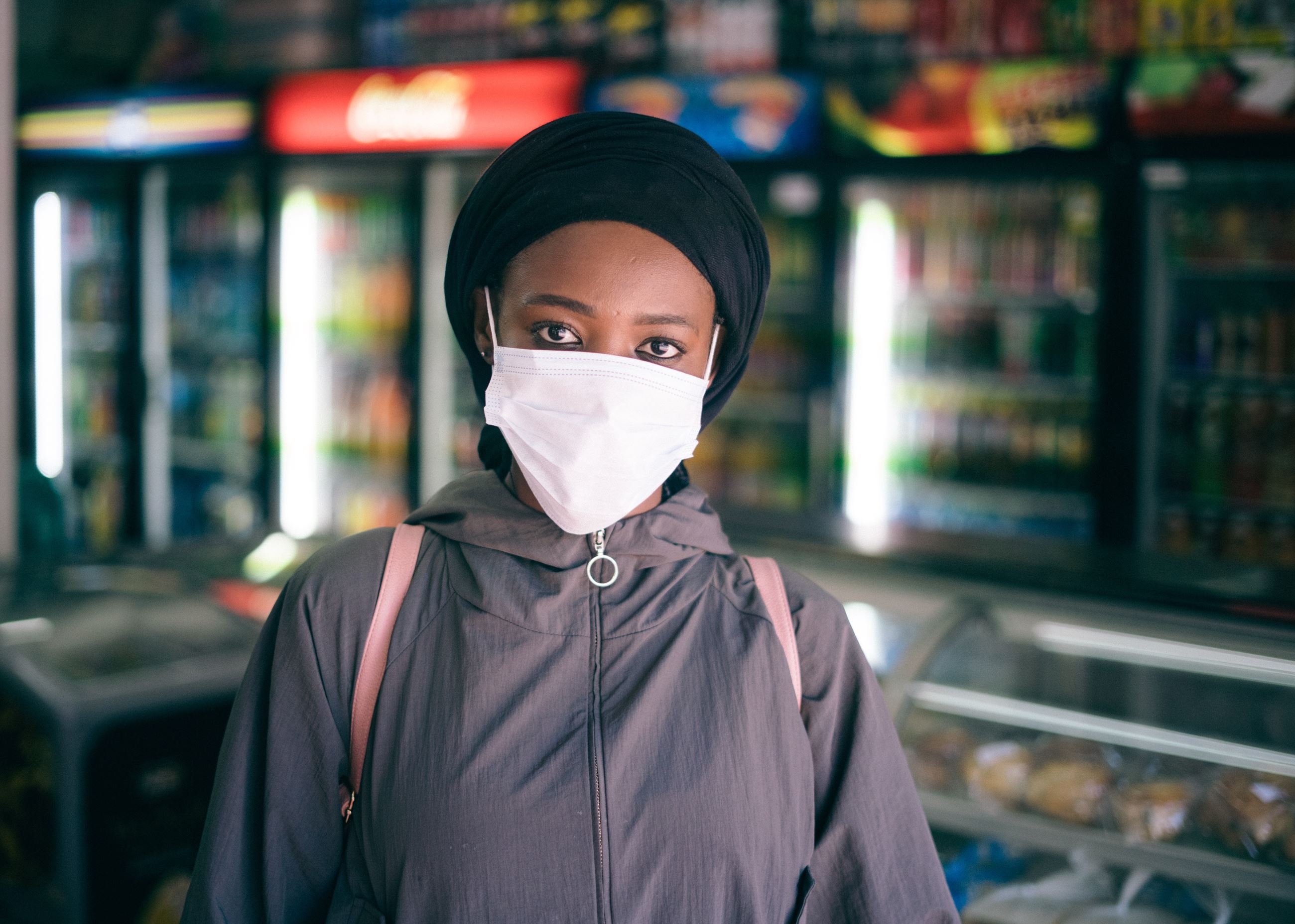 A woman wears a protective mask in store