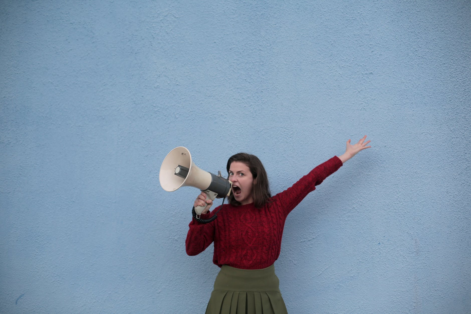 A woman speaks into a megaphone